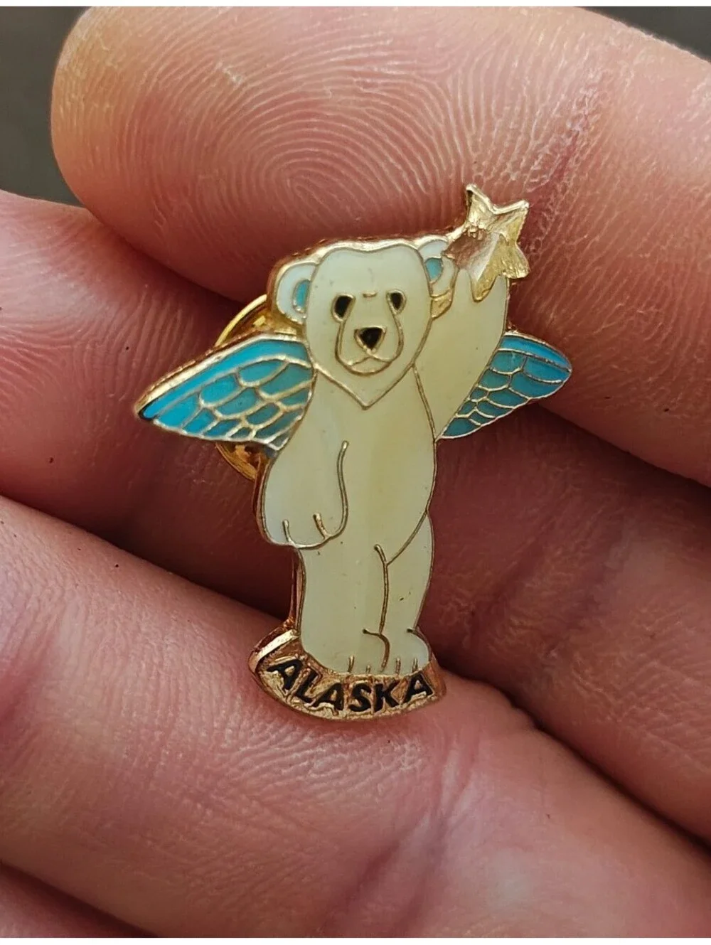 1980s Alaskan Polar Bear Guardian Angel Gold Tone Enamel Pin.